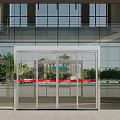 Automatic Glass Door Entrance With Glass Curtain Wall And Exterior Tree Reflection