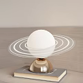 Modern Table Lamp With White Spherical Shade Transparent Rings And Golden Base