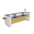 Modern Reception Desk With Gray Countertop Wooden Cabinets Two Computer Monitors And Green Plant