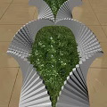 Modern Garden Ornament With White Fan Shaped Structure And Green Plants On Beige Tiled Floor