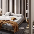 Cozy Double Bed with Striped Wall Table Lamp Brown Blanket and Fireplace