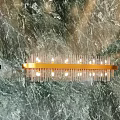 Elegant Modern Chandelier With Gold Frame And Transparent Glass Rods On Marble Wall Background