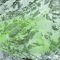 Scenic Snowy Mountain Terrain With Snow Covered Rocks And Evergreen Trees