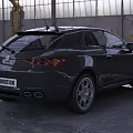 Black Alfa Romeo Coupe Parked in Industrial Warehouse With Glass Roof
