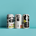 Three White Canned Beverages With Black Asian Style Text On Light Blue Background