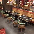 Stylish Hotpot Restaurant Interior With Wooden Dining Tables Green Chairs And Pendant Lights