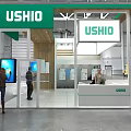 USHIO Exhibition Booth With Green Canopy Wooden Structure And Display Screens