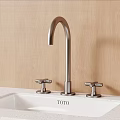 TOTO Brushed Metal Faucet With Two Handles On White Countertop And Wooden Wall