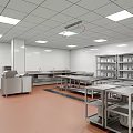 Commercial Kitchen Interior With Stainless Steel Worktables Storage Racks And Bright Ceiling Lights