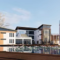 Modern Office Building Architecture Exterior With Glass Curtain Wall Wooden Elements Water Pool And Tower