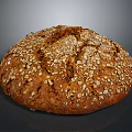 Freshly Baked Round Brown Bread With Oats And Seeds On Crusty Surface