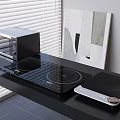 Modern Black Kitchen Countertop With Built In And Portable Induction Cooktops And Countertop Oven Appliances