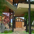 Rustic Wooden Mountain Lodge With Multiple Levels And Green Hills