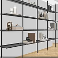 Modern Black Metal Shelving Unit With Decorative Vases Books And Ornaments In Interior Space