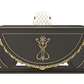 Elegant Dark Wooden Office Desk With Golden Accents Intricate Patterns And White Padded Chair