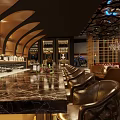 Luxurious Bar Interior With Marble Counter Leather Chairs Wine Racks And Chandeliers