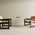 Two Modern Leisure Chairs With Black Frame And Beige Cushion In Simple Interior