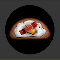 Yellow Cartoon Character On Bread With White Sauce Red Strips Green Garnishes On Black Plate