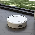 White Robot Vacuum Cleaning Wooden Floor By Window With Curtain And Green Grass
