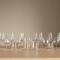 Assorted Glassware Collection Featuring Wine Glasses Champagne Flutes Water Glasses On Wooden Tabletop
