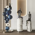 Abstract Sculptures Human Figures On Marble Pedestals Blue Spherical Stacked Design In Modern Interior