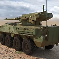 Two Tan And Green Armored Tanks On Sandy Terrain Under Blue Sky White Clouds