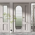 Black Swing Doors with Arched Glass Panels and Indoor Green Plant Decoration