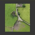 Miniature Castle Model on Scenic Green Grassland With Pathway and Trees