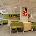 Modern Restaurant Interior With Green Chairs Light Tables White Walls And Artwork