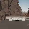 White Irregular Shaped Sofa in Outdoor Rocky Canyon Setting with Natural Stone Walls