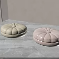 Cream And Light Pink Pumpkin Shaped Poufs On Marble Floor