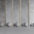 Minimalist Interior Featuring Gray Textured Wall Panels And Spherical Decor