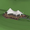 White tent like building on hilltop in misty green meadow with distant mountains