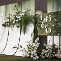 Elegant Wedding Decor With Green White Floral Arrangements And Forever In Love Sign