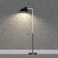 Modern Floor Lamp With Black Shade And Silver Base Offering Bright Lighting For Room