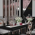 Shopping Mall Hall With COSMOM Booth Cherry Blossom Decorations Tables Chairs And Product Displays