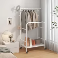 White Mobile Clothes Rack With Wheels Coats Hats Bags And Storage Boxes In Bedroom Setting