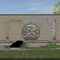 Stone Landscape Wall With Ornate Circular Carving And Surrounding Green Plants Rocks And Lawn