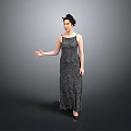 Elegant Woman In Patterned Long Dress Standing With Extended Arm On Gray Background