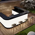 Stylish Outdoor Bar With Black Countertop White Base And Gold Bar Stools On Wooden Deck