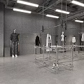 Modern Industrial Style Clothing Store With Cozy Lounge And Sleek Cement Interior Design