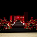 Elegant Banquet Hall With Red Floral Decorations And Wedding Stage Setup