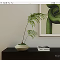 Bonsai Plant With Green Leaves In Light Colored Pot On Black Shelf And Abstract Painting