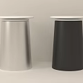 Two Modern Cylindrical Stools With Silver And Black Bodies And White Round Seats