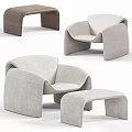 Modern Beige Upholstered Leisure Chair With Curved Design And Matching Ottoman