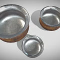 Three Wooden Ceramic Vessels With Silver Rimmed Open Tops And Textured Bodies