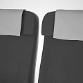 Public Chairs With Three in a Row Gray Seats White Headrests Metal Frames and Armrests