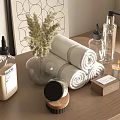 Stylish Bathroom Countertop With Rolled Towels Glass Bottles Candle And Dried Plants