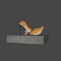 Cartoon Gecko With Large Blue Eyes Performing On Platform Near Microphone