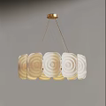 Modern Gold Base Chandelier With Circular Frosted Glass Shades And Soft Ambient Lighting